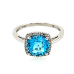 White Gold Blue Topaz and Diamond Ring