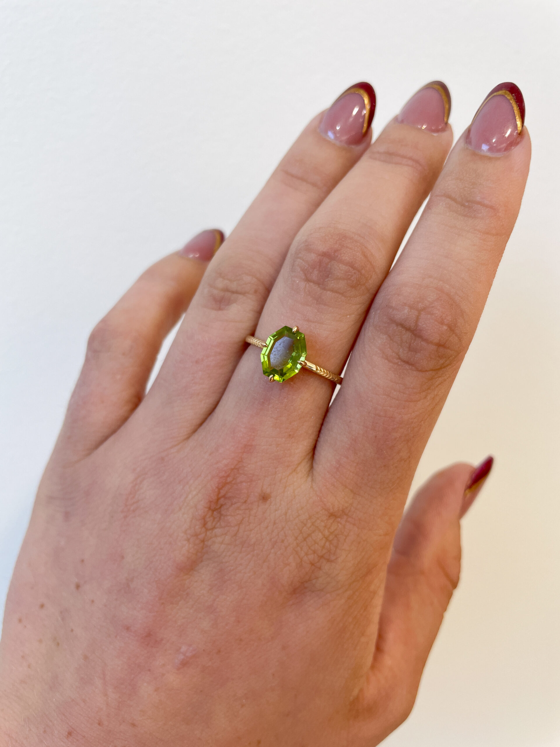 Yellow Gold Hexagon Peridot Ring with Herringbone Shank