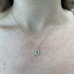 Yellow Gold Oval Emerald Necklace with Diamond Halo