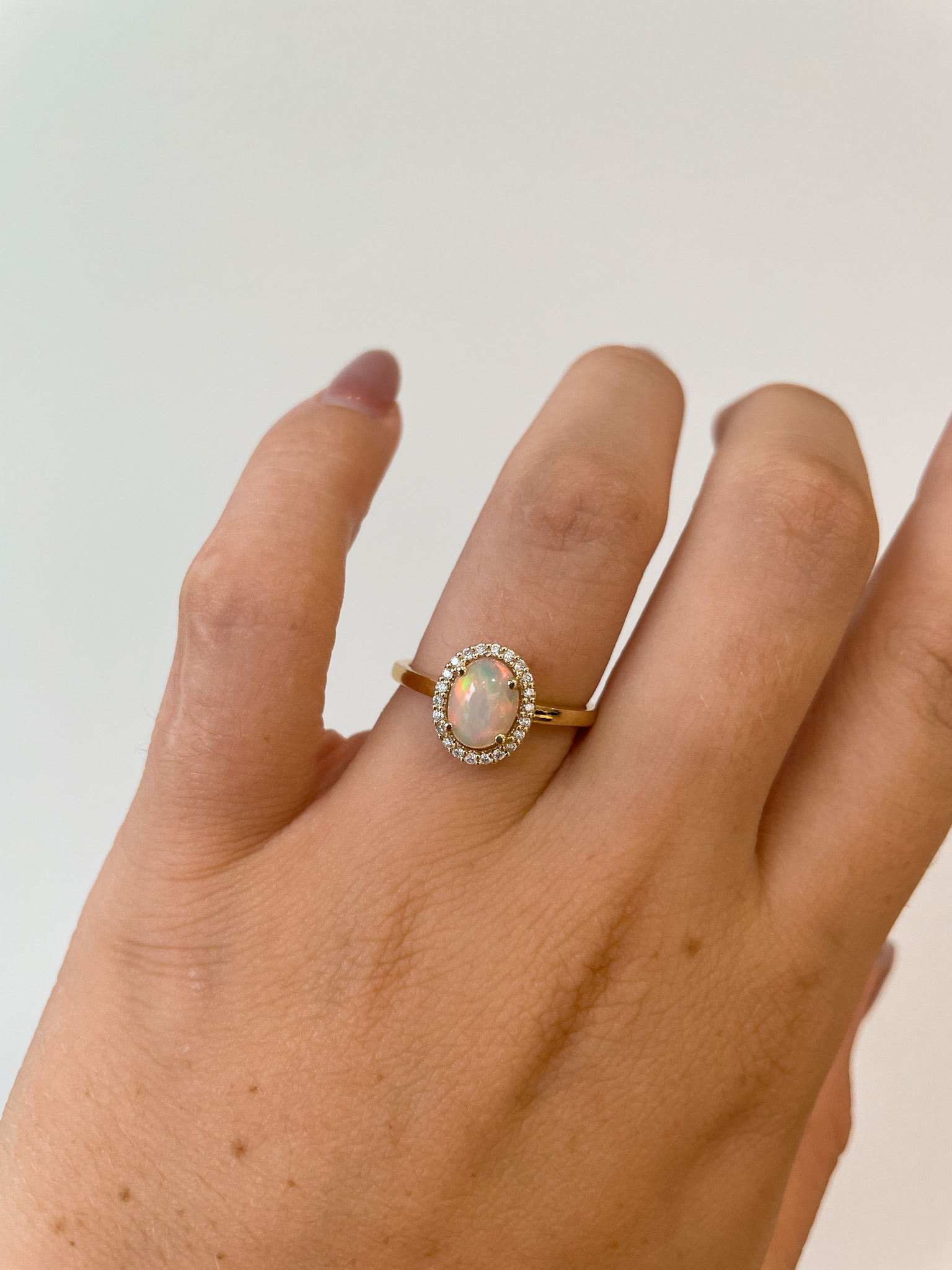 Yellow Gold Opal Ring with Diamond Halo
