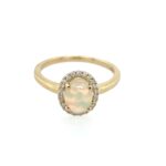 Yellow Gold Opal Ring with Diamond Halo